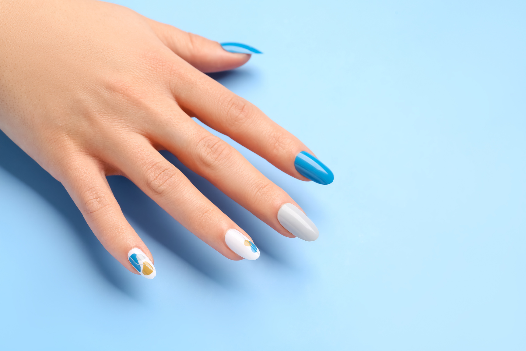 Woman with Press-on Nails on Blue Background